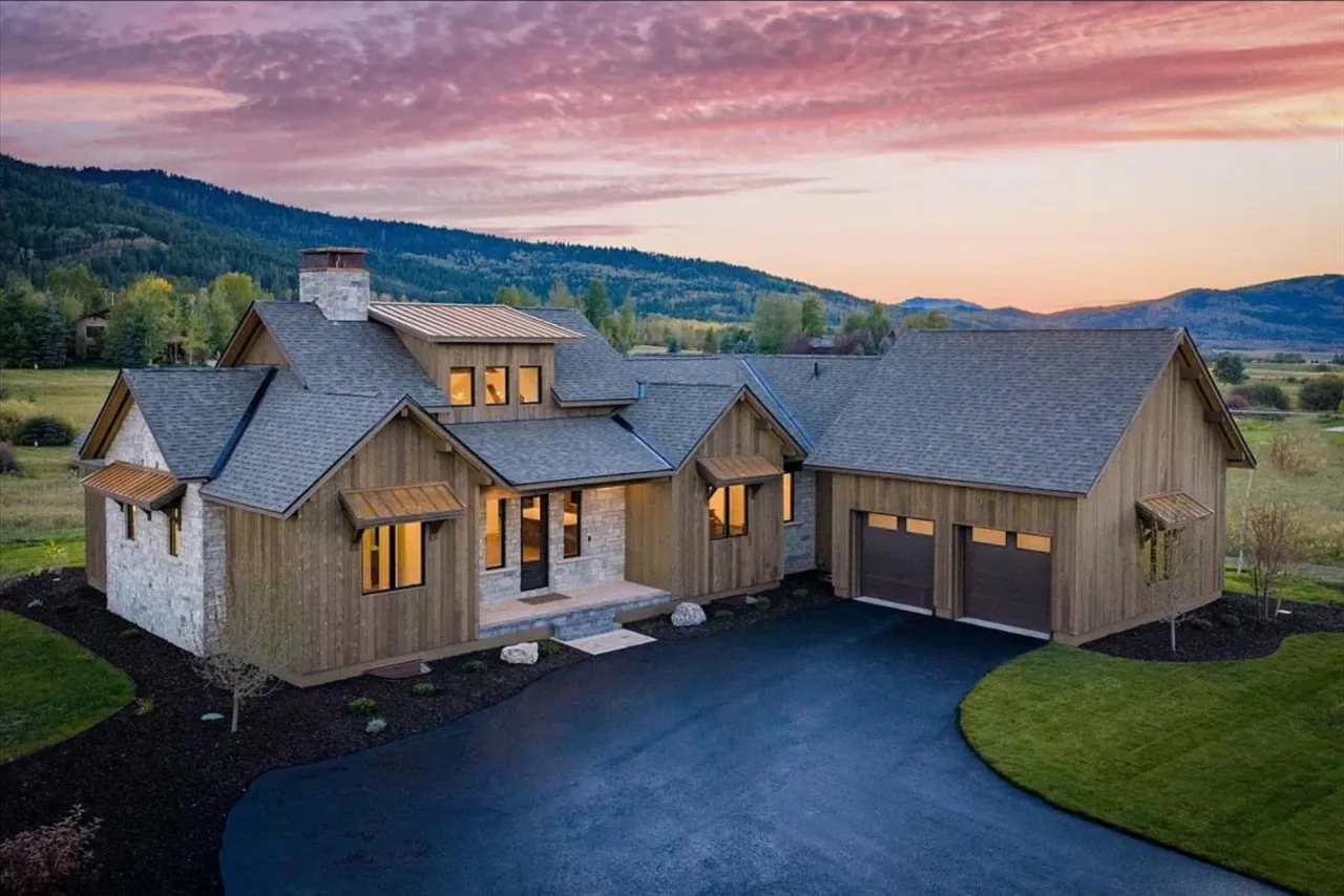 88 Hastings Drive at sunset, a custom home in Teton Springs, Victor, Idaho